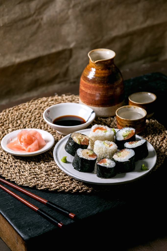 Sushi with sake set on woven mat